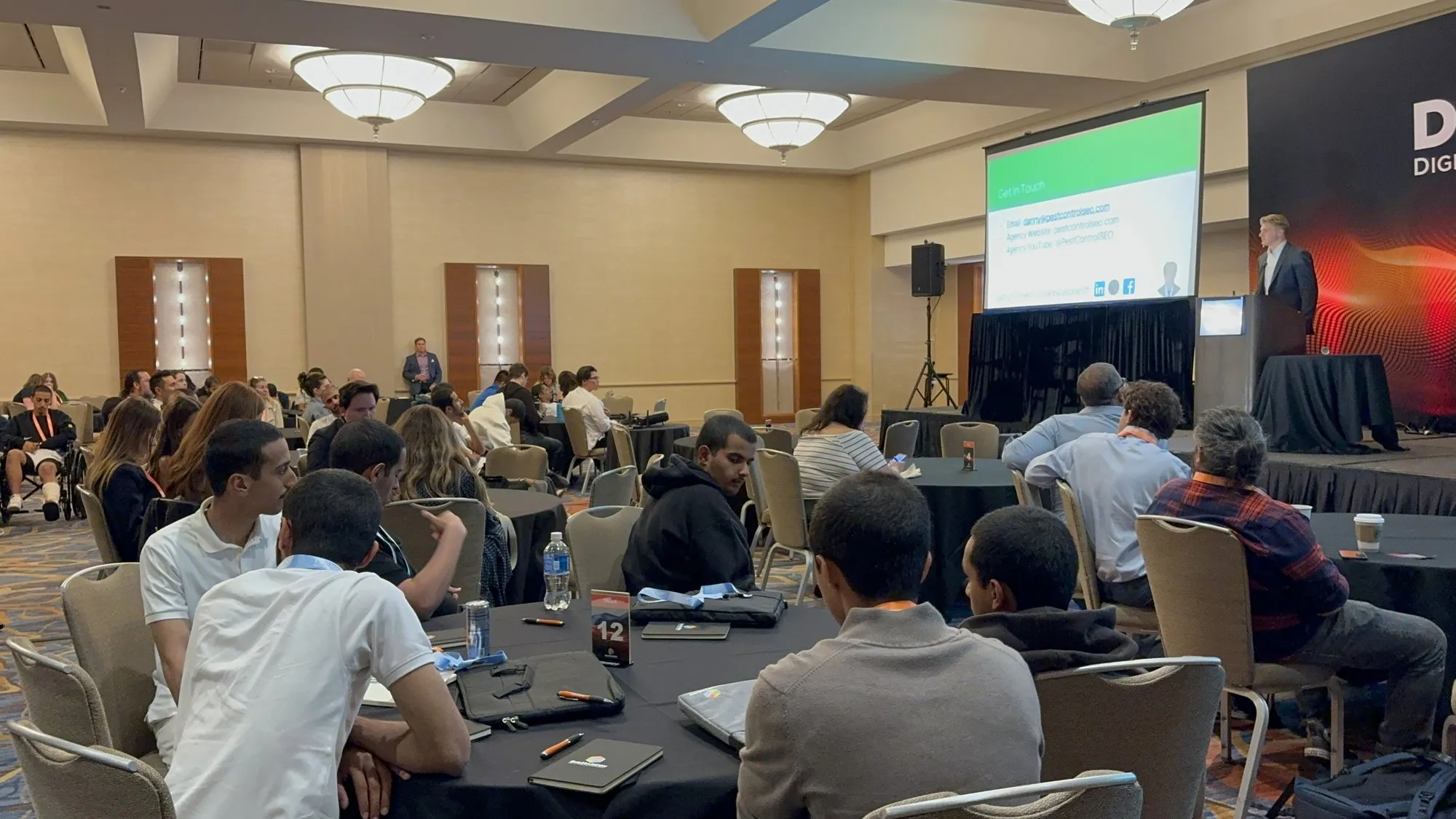 Dan Leibrandt speaking to a room of attendees at a DigiMarCon session